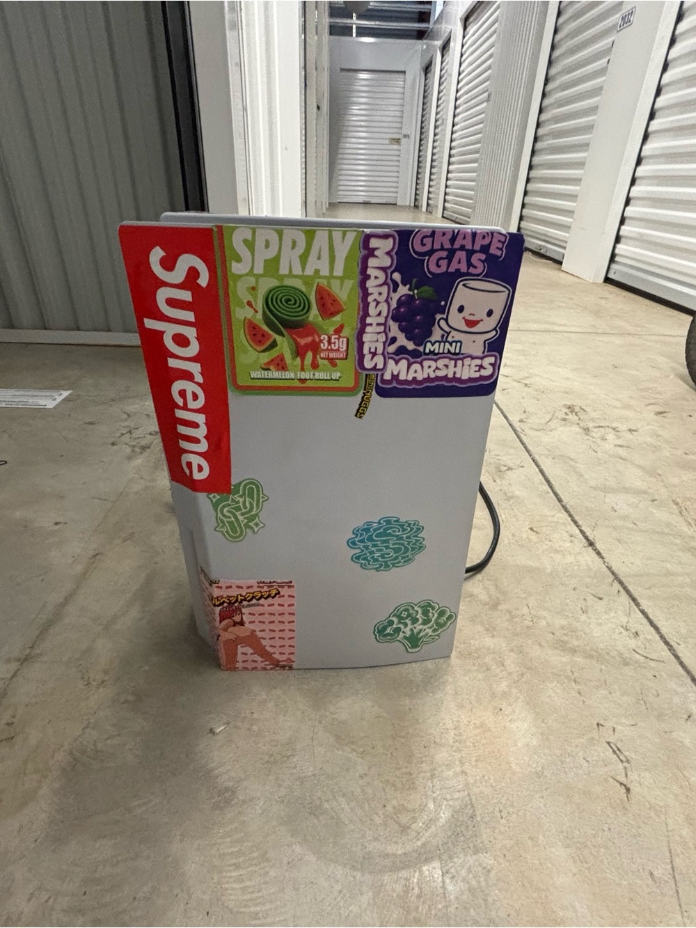 Sony playstation with Red Supreme Decal and Colorful Sticker Accents